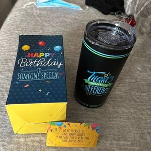 New in box Birthday Tumble . Black with green and blue lettering.